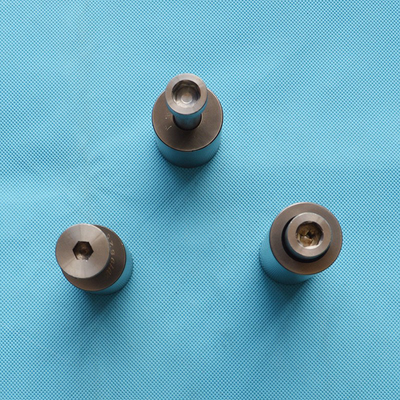Wear resistant moving and stationary needles